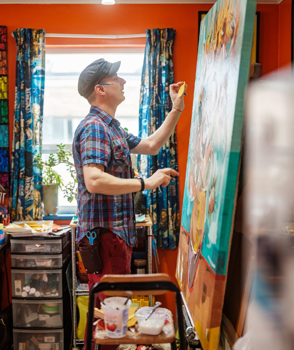 Man working on large canvas